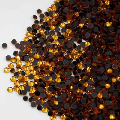 China Flatback Topaz DMC Hotfix Rhinestone Crystal With Glue On Flatback Heat Press Stones For Transfer for sale