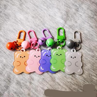 China Cute Ring Pendant Girl Aripod Case Keychains Jewelry Bag Wholesale Jewelry Bag Key Chain Cute Acrylic Pendant Bell Bear for sale