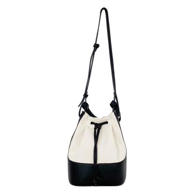 China 2022 Fashion High Quality Leather Heavy Women's Shoulder Bag Drawstring Color Portable Block PU Bucket Bag Handbags for sale