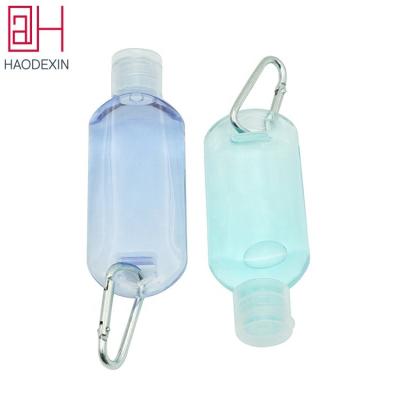 China HAODEXIN Single Empty Refillable Plastic Bottle Hand Lotions PET 50ml Pocket Bottle With Hook Gel Bottle Flip Top Caps for sale