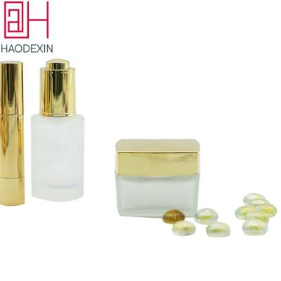 China Portable Stylish 50ml Skin Care Packing Cream HAODEXIN Frosted Square Glass Face Eyes Cream Jar With Metal Lid Wholesale Custom Color Cosmetic Container for sale