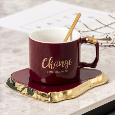 China Wholesale Minimalist Style Nordic Home Ceramic Coffee Cups Mugs Irregular Gold Handle Ceramic Coffee Cup and Saucer Sets for sale