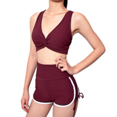 China Beautiful sexy women's bra back yoga suit breathable gym one shoulder belt short pants drawstring set two piece set for sale