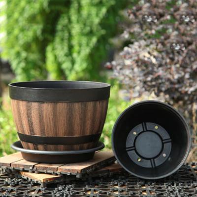 China Heavy Duty Round Round Outdoor Cartoon Vintage Garden Pots Planters Tray Resin Whiskey Barrel Flower Large Capacity Pot Planter for sale