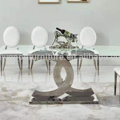 China Foshan New Modern Furniture Good Good Prices Foshan Stainless Steel Round 12mm Glass Top Dining Table for sale