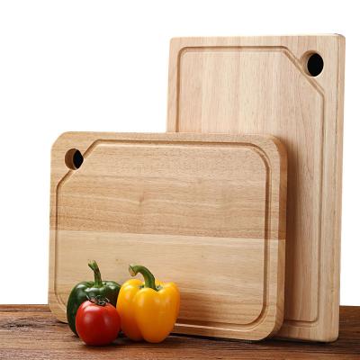 China Sustainable Oak Premium Connection The Chopper Solid Wood Kitchen Organic Wooden Cutting Board With Drip Juice Groove for sale