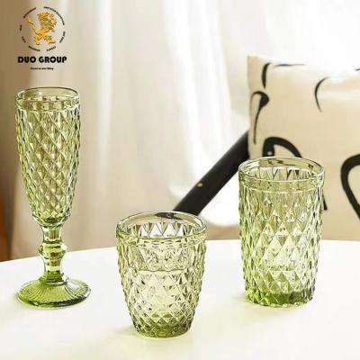 China Stock Wholesale Colored Wine Glasses Colored Water Goblets Cups For Party And Wedding Champagne Goblet Embossed Glasses for sale