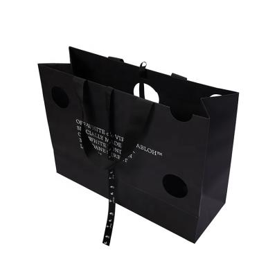 China Eco-friendly Luxury Black Custom Printed Gift Paper Bag Large Logo Jewelry Packaging Bag With Ribbon Handles for sale