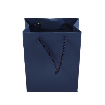 China Eco - Friendly Custom Exquisite Gift Sack Dark Blue Paper Bags for sale