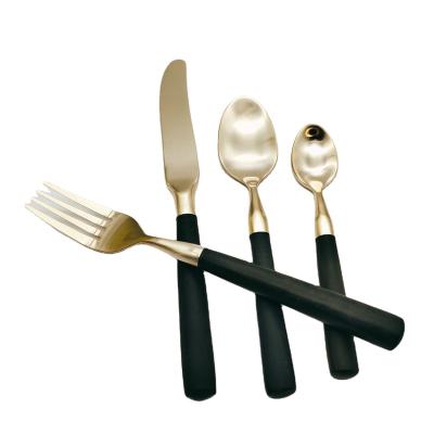 China Sustainable Black POM Handle Cutlery Resin Handle Copper Gold Flatware Set for sale