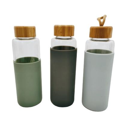 China Sustainable Lid 500ML Borosilicate Drinking Glass Bamboo Water Bottle for sale