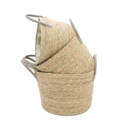 China Sustainable Woven Artificial Flower Sea Grass Basket Straw Flower Basket With Plastic Liner Precipitation Grass Made Flower Basket With Handle for sale