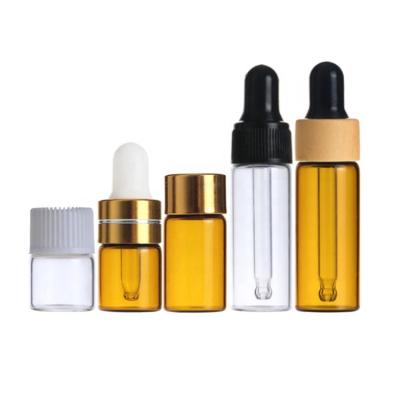 China Personal Care 1ml 2ml 3ml Essential Oil Amber Mini Sample Vials Glass Bottles With Black Screw Cap Plastic Orifice Reducer for sale