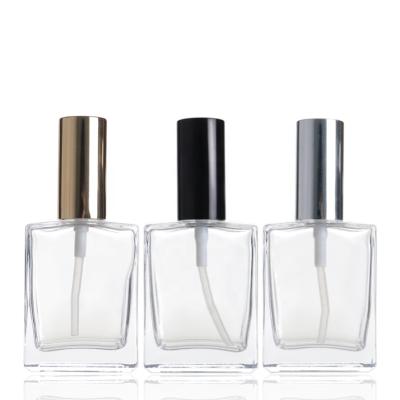 China Cosmetic Empty Perfume 50ml Square Spray Glass Bottles With Spray Cap for sale