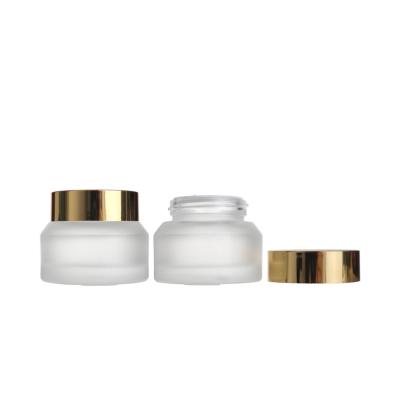 China Wholesale 30g Empty Clear Frosted Cosmetic Eye Face Cream Cosmetic Glass Jars With Gold Lid for sale