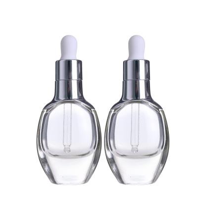 China 30ml round shape oud cosmetic luxury high end luxury clear essential oil LAMEER glass dropper bottle oil with silver ring cap for sale