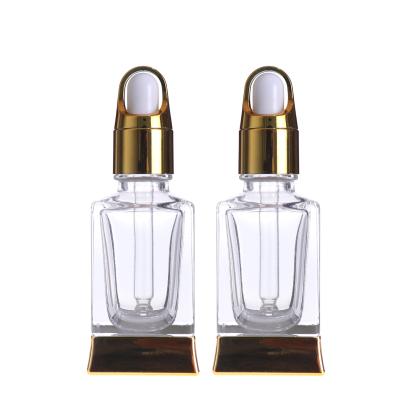 China Cosmetic luxury clear 30ml vitnam oud essential oil serum glass dropper bottle with silver gold basket cap for cosmetic for sale