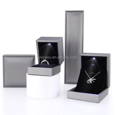 China White Jewelry Display Gift Packing Case Luxury Custom Stock Ring Box PU Led Light Jewelry Box Gift With Custom Logo for sale