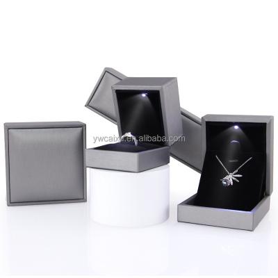 China White Jewelry Display Gift Packing Case Luxury Custom Stock Ring Box PU Led Light Jewelry Box Gift With Custom Logo for sale