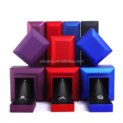 China Luxury Stock Custom Ring Box Plastic Jewelry Display Gift Packing Case White Led Light Jewelry Box Gift With Custom Logo for sale