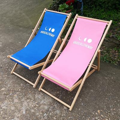 China Custom chic beech fabric outdoor frame beech fabric canvas lounge hotel advertising sublimation print logo foldable lounge chair stable durable wooden for sale