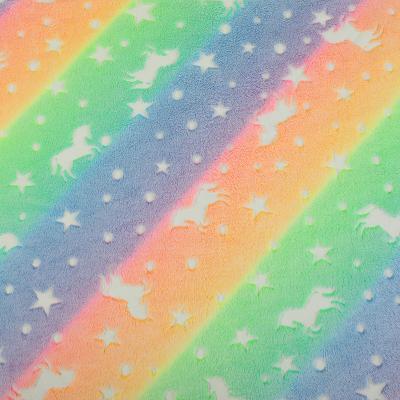 China Breathable Double Sided Unicorn Rainbow Glow in Dark Flannel Fabric for sale