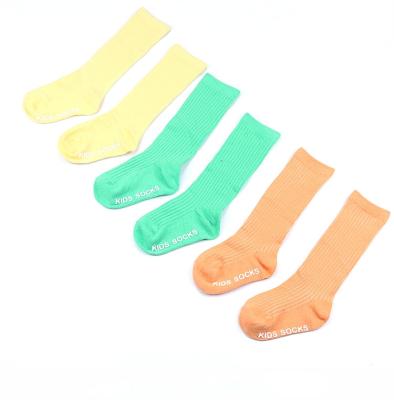 China Sustainable Ready To Ship Candy Color Cute Computer Knitted Anti Slip Custom Baby Socks for sale