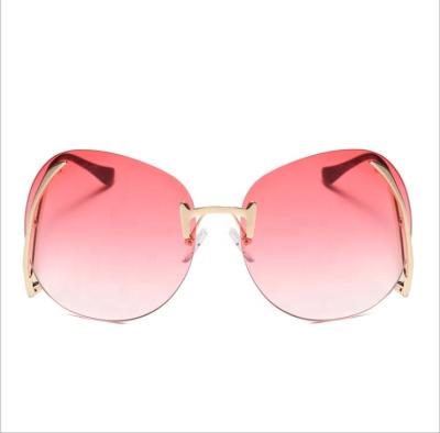 China Newest Fashion Rimless Curvature Leg Sunglasses Women Brand Designer Trend Colorful Lens Sun Glass Style Female Eyewear for sale