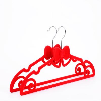 China Wardrobe Bowknot Shape Non Slip Slim Red Velvet Space Saving Hanger for sale