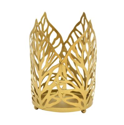 China 2021 Creative Hot Selling Nordic Gold Iron Used Hollow Leaf Candlestick Home Decoration Candlestick Ornaments Wedding Decor Crafts for sale