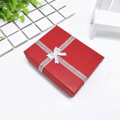 China China Supplier Sales Small Fancy Handcrafted Paperboard Earring Storage Box Small Logo Printed Jewelry Packaging Box With Bow for sale