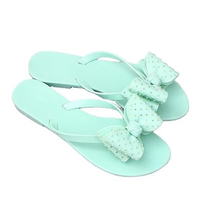 China New Jelly Summer Trend Fashion Bow Tie Slippers Flat PVC Sandals Flip Flops For Ladies Holiday Beach Non-slip Shoes 2022 for sale