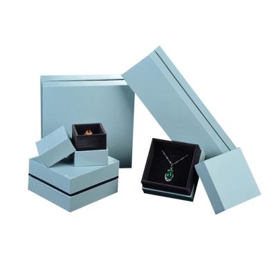 China Handmade High End Light Blue Color Leatherette Paper Jewelry Ring Box Packaging With Custom LOGO for sale