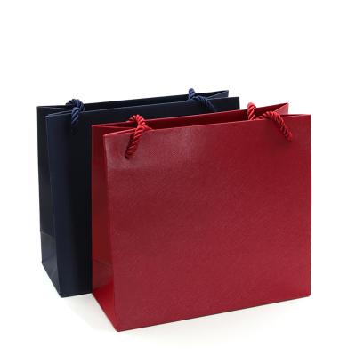 China Handmade Custom LOGO Paper Jewelry Cardboard Shopping Bag For Jewelry High Quality Carry Bag Red Blue Clothes Cardboard Gift for sale