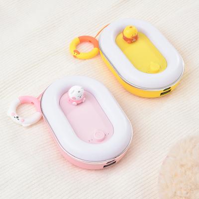 China Hot Selling Cute Design Electric Hand Mini Power Bank With Hand Convenient Power Bank Hotter for sale