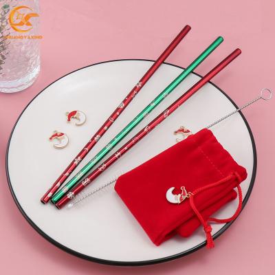 China Customized Sustainable Christmas Straw LOGO Stainless Steel Christmas Drinking Straws In Green Metal Set With Red Bag for sale