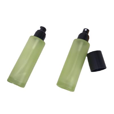 China Luxury Green Color Glass Spray Bottle 100ml Cosmetic Bottle Skin Care Packaging for sale