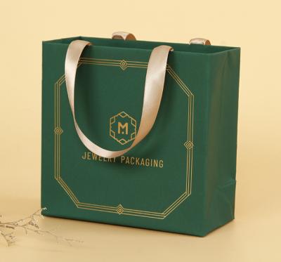 China Recyclable Luxury Black Custom Printed Paper Bag Logo Jewelry Packaging Kraft Shopping Gift Paper Bag With Ribbon Handles for sale