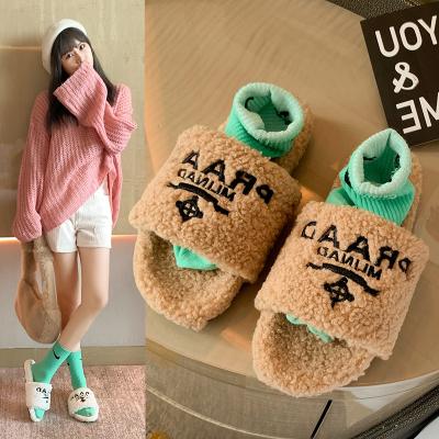 China 2021 Korean flat slipper plush warm sheepskin with letters fluffy soft platform slippers for sale