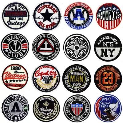 China Weave Patches Heating Circle Around Woven Self Adhesive Filled Woven Patch For Non Woven Baby Shirt Patch Woven for sale