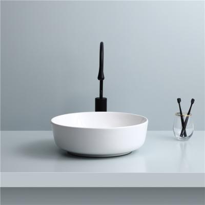 China Durable Creative Round Ceramic Face Basin Table Top Bathroom Basin For Washroom for sale