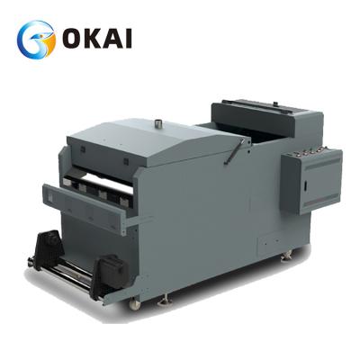 Cina OKAI 2021 L1800 t shirt printer heat transfer CMYK W pet film printer with powder shaking machine in vendita