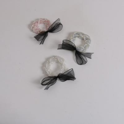 China 2022 New Korean Temperament Hair Rope Crystal Head Rope Wholesale Pearl 2pcs Fashionable Organza Bow Tie Crystal Pearl Hair Rope Black for sale