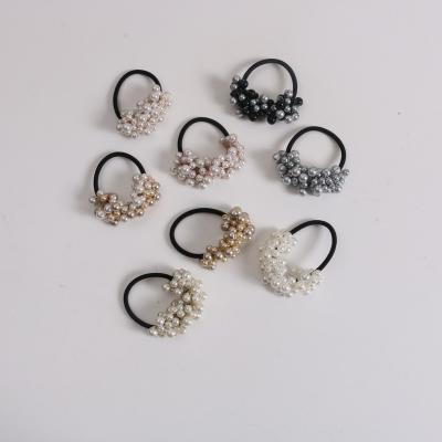 China 2022 New Girl's Sweet Pearl Hair Rope Hair Rope Ring Beaded Braided Single Korean Simple Hair Rope Wholesale And Cute Semicircle Head Rope for sale