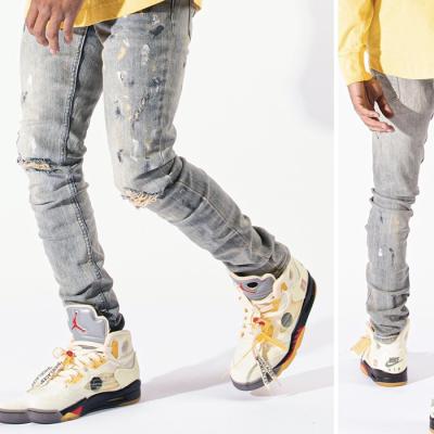 China Breathable Mens High Waist Street Style AIPA Paint Splatter Super Skinny Distressed Denim Jeans For Men for sale