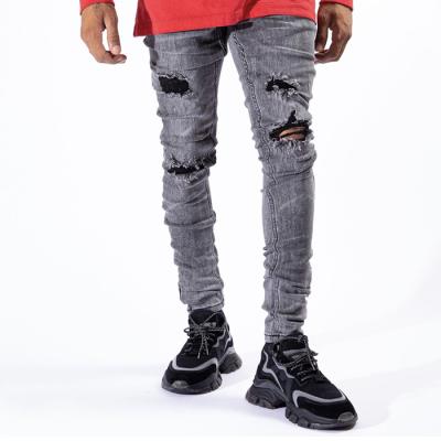 China AIPA Breathable Slim Fit White Paint Splatter Washed Cargo Jeans Distressed Ripped Jeans Men for sale