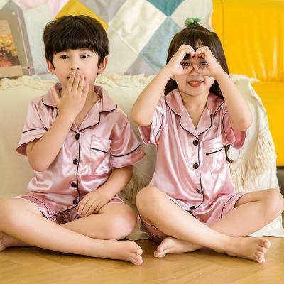 China Boys and Girls Solid Color Short Sleeve Suit Children's Stain QUICK DRY Pajamas for sale