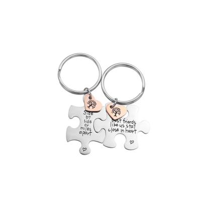 China Newest Design Valentine's Day Gift High Polishing Stainless Steel Engrave Metal Puzzle Couple Key Chains for sale