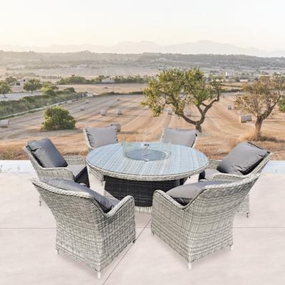 China Modern Outdoor Dining Table And Chair Garden Courtyard Hotel 6 Seats Round Table Rattan Furniture for sale