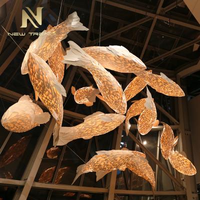 China Modern Indoor Large Hotel Lobby Wooden Staircase Project Fish Light Decoration Chandelier Lamp Custom Made for sale